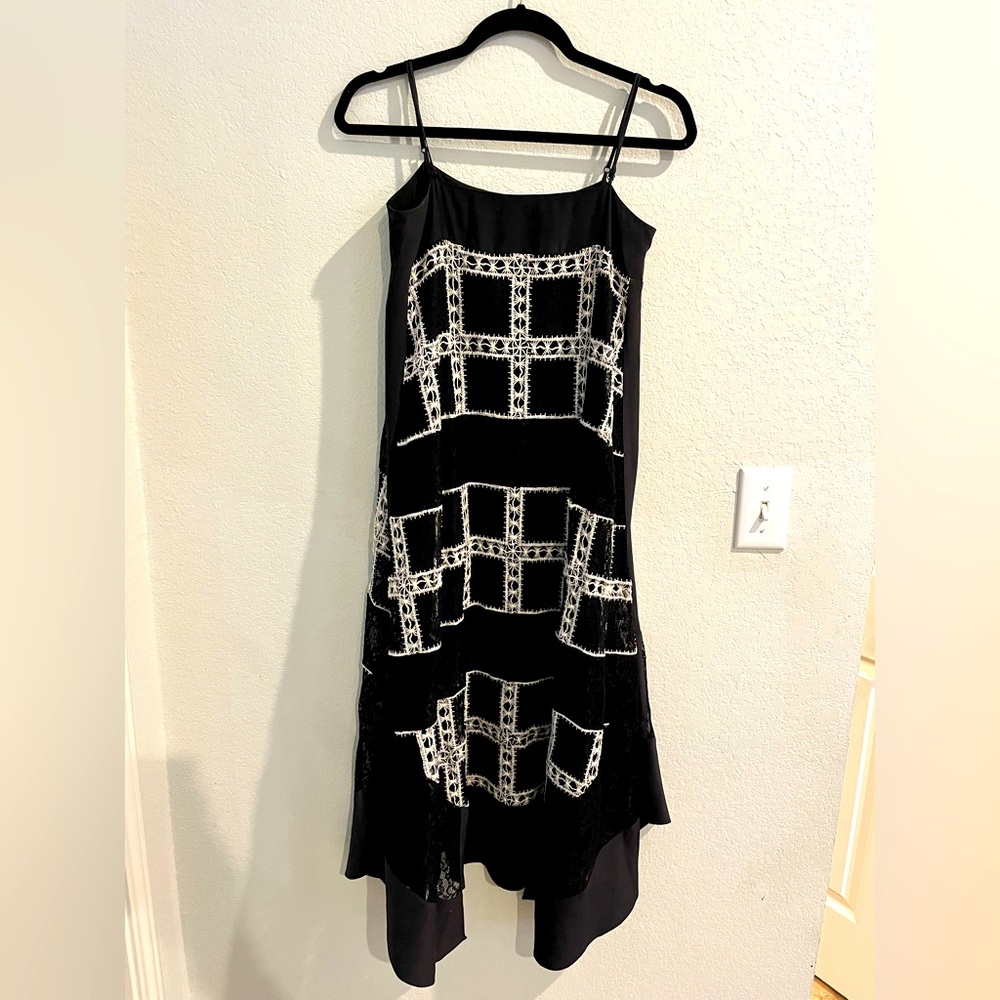 Light and breezy maxi dress with handkerchief hem and beautiful lace overlay.